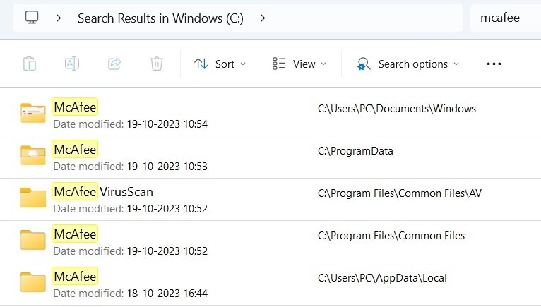 McAfee results shown in File Explorer.