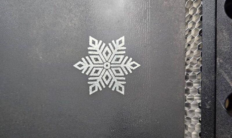 Engraving a snowflake into aluminum. 