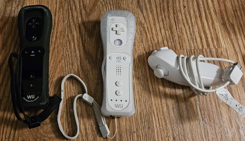 Three Nintendo Wii controllers